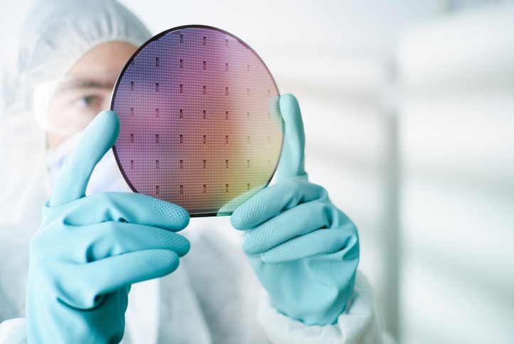 Scientist examining silicon wafer